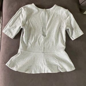 Grey peplum zip up top